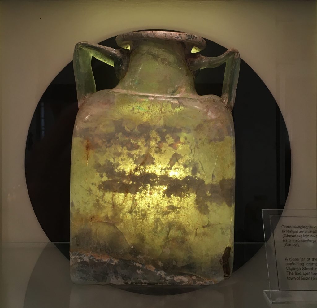 A glass funerary urn 