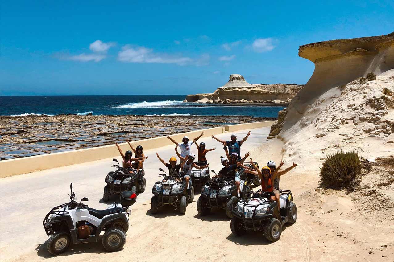 Quadbike tour stop at the Xwejni Saltpans in Gozo