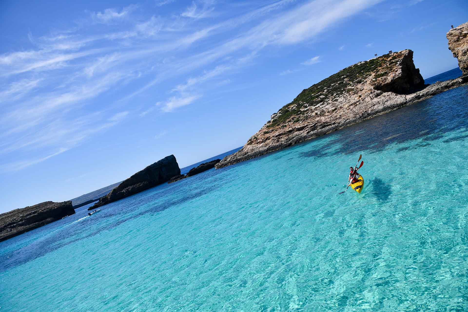 The island's crystal-clear waters make it ideal for a kayaking trip.