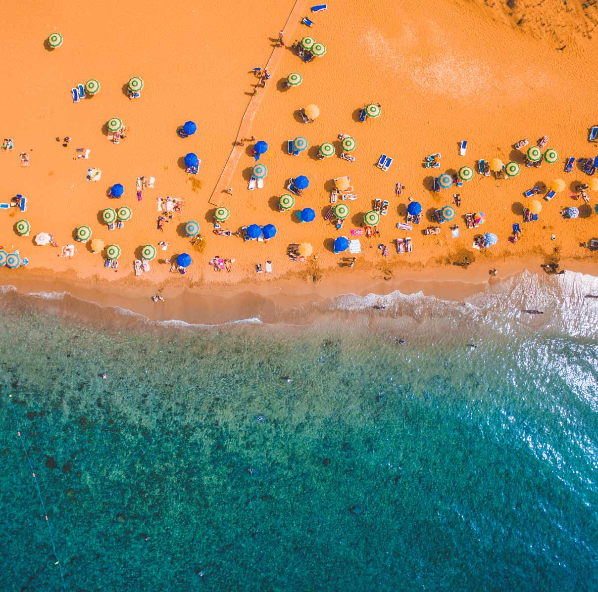Aerial shot of Ramla Bay on a summer's day